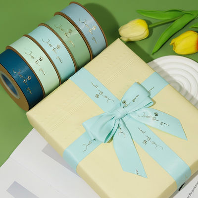 Chuỗi băng satin được in bằng nhựa vàng được tùy chỉnh để đóng gói quà tặng