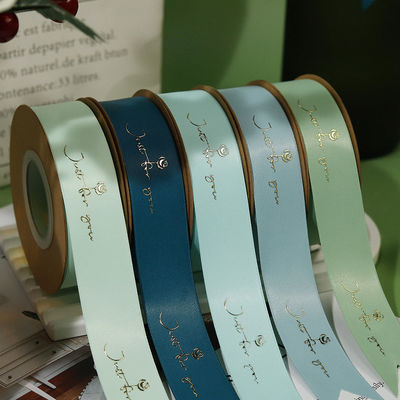 Chuỗi băng satin được in bằng nhựa vàng được tùy chỉnh để đóng gói quà tặng